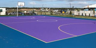 Basketball court with Tour Purple play area and Byron Blue surround.