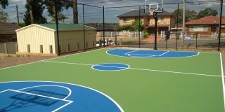 Basketball court in Grass Green and Byron Blue